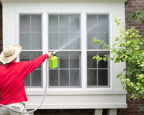 Man,Spring,Cleaning,The,Exterior,Of,His,House,Washing,Down Man,Spring,Cleaning,The,Exterior,Of,His,House,Washing,Down