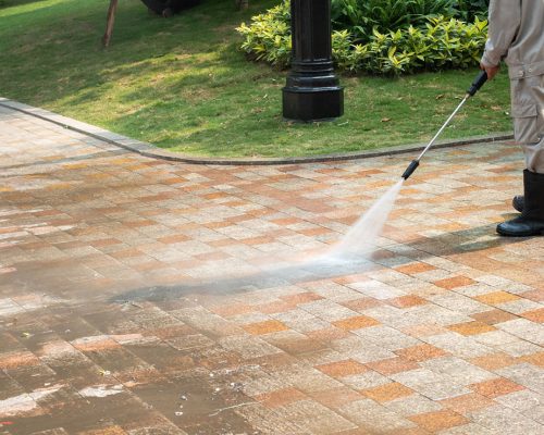 Outdoor floor cleaning with a pressure water jet on street Outdoor floor cleaning with a pressure water jet on street