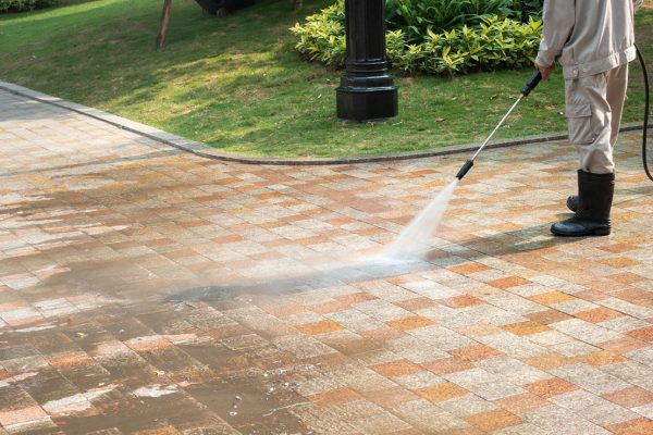 Outdoor floor cleaning with a pressure water jet on street Outdoor floor cleaning with a pressure water jet on street